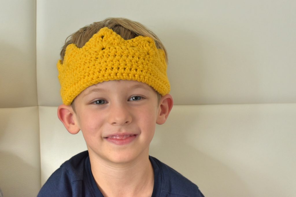 Boy wearing crochet crown